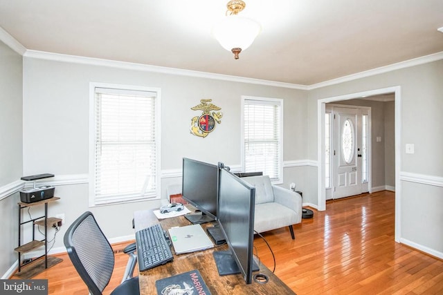 office featuring wood finished floors, baseboards, and ornamental molding
