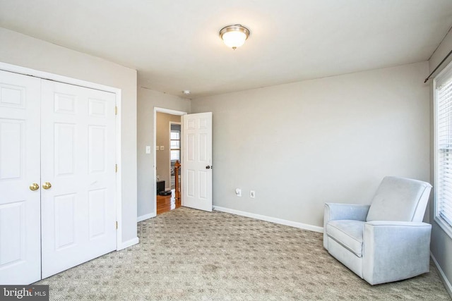 unfurnished room featuring baseboards and carpet flooring