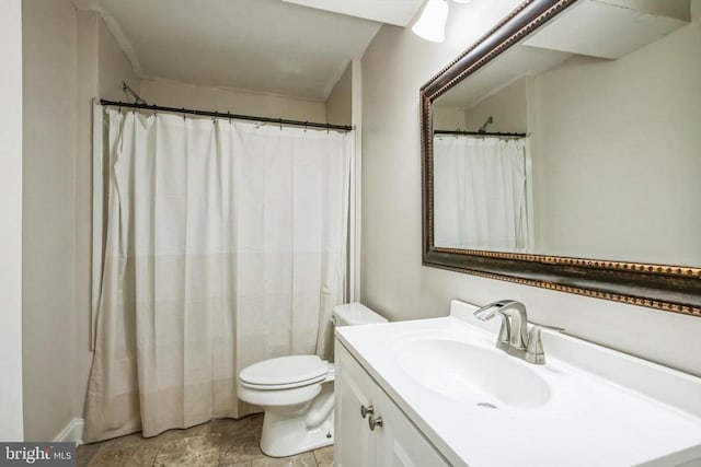 bathroom featuring toilet and vanity
