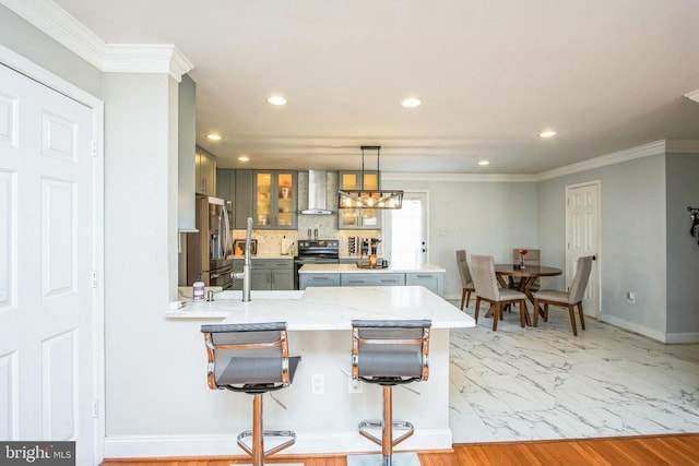 kitchen featuring a peninsula, black range with electric cooktop, wall chimney exhaust hood, stainless steel refrigerator with ice dispenser, and recessed lighting