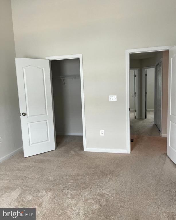 12112 Bowling Farm Ct, Fredericksburg, VA 22407 - unfurnished bedroom with carpet flooring and a closet