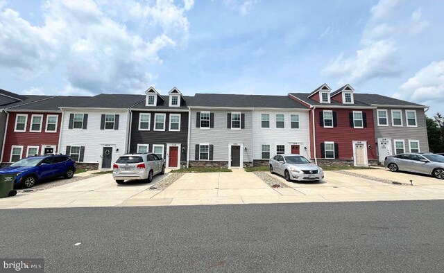 12112 Bowling Farm Ct, Fredericksburg, VA 22407 - view of property with uncovered parking and stone siding