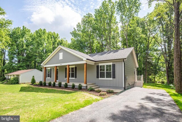 Pine Harbour Dr, Mineral, VA 23117 - view of front of home featuring a porch, a front yard, driveway, and roof with shingles