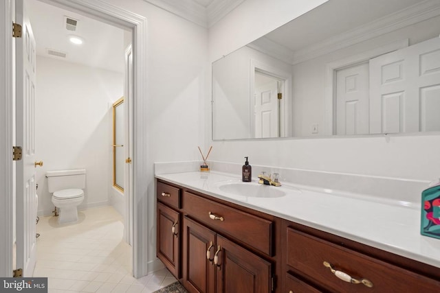  - full bathroom featuring vanity, toilet, combined bath / shower with glass door, tile patterned flooring, and crown molding