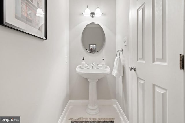 - bathroom featuring baseboards