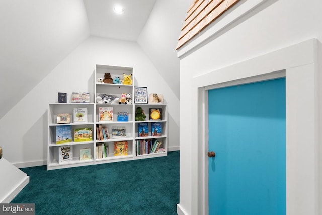  - recreation room featuring carpet floors and vaulted ceiling