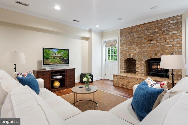  - living room featuring crown molding, wood finished floors, recessed lighting, and baseboards