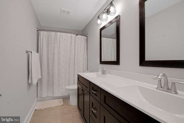 1909 Artillery Ridge Rd, Fredericksburg, VA 22408 - full bathroom featuring toilet, double vanity, tile patterned floors, and baseboards