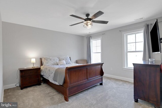 1909 Artillery Ridge Rd, Fredericksburg, VA 22408 - bedroom with light carpet, baseboards, and a ceiling fan