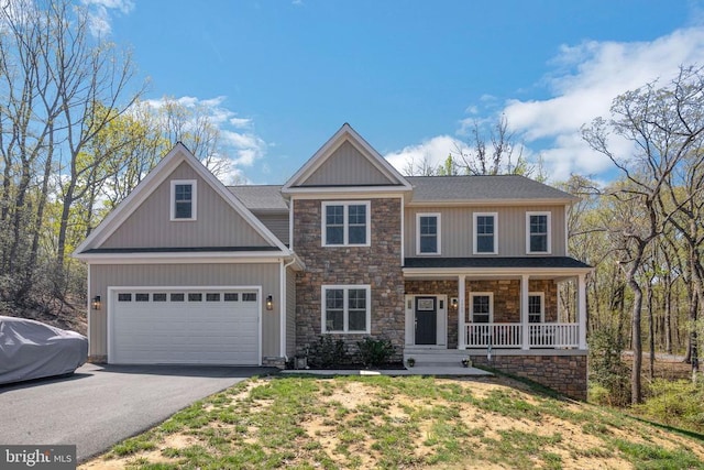 1909 Artillery Ridge Rd, Fredericksburg, VA 22408 - craftsman inspired home featuring stone siding, covered porch, asphalt driveway, and a garage