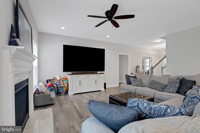 1909 Artillery Ridge Rd, Fredericksburg, VA 22408 - living room featuring ceiling fan, light wood finished floors, a premium fireplace, and recessed lighting