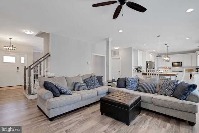 1909 Artillery Ridge Rd, Fredericksburg, VA 22408 - living room with light wood-style flooring, ceiling fan, a chandelier, recessed lighting, and stairway