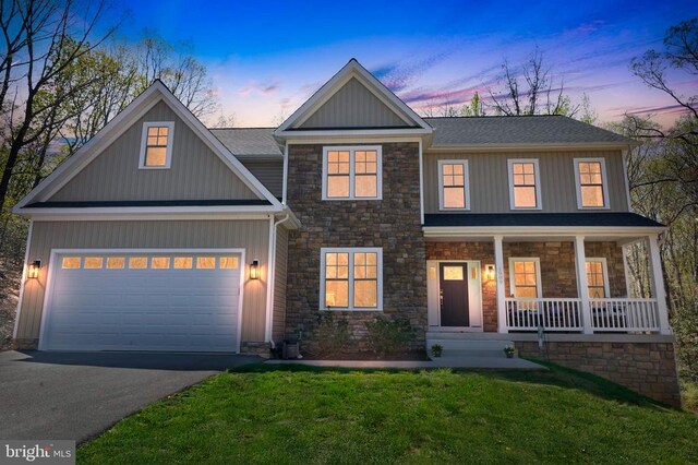 1909 Artillery Ridge Rd, Fredericksburg, VA 22408 - craftsman-style home with stone siding, a porch, driveway, a garage, and a yard