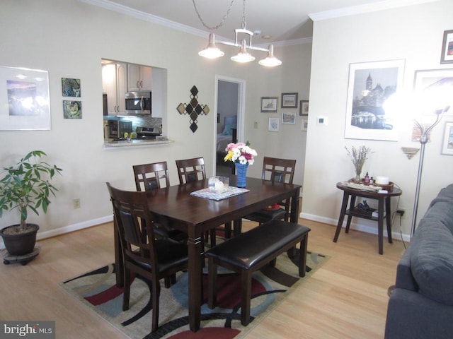 11200 Scottwood Ln N, Fredericksburg, VA 22407 - dining area with light wood-style floors, crown molding, and baseboards