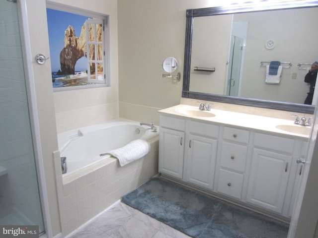 11200 Scottwood Ln N, Fredericksburg, VA 22407 - bathroom featuring a garden tub, double vanity, a shower stall, and marble look tile flooring