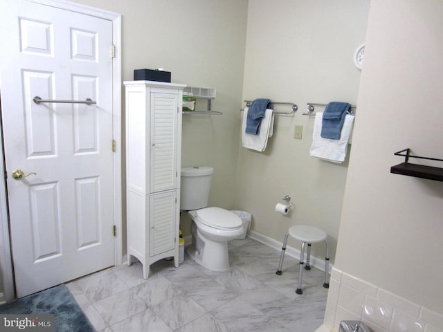 11200 Scottwood Ln N, Fredericksburg, VA 22407 - bathroom featuring toilet, marble finish floors, and baseboards