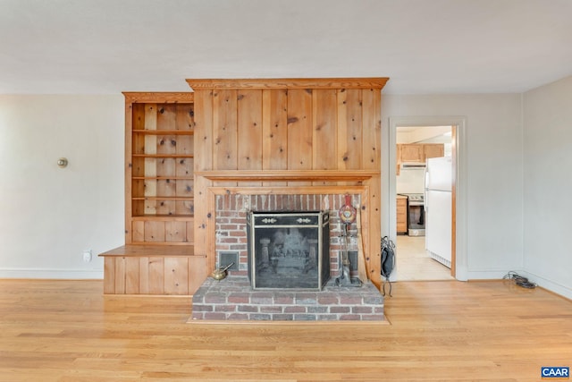 129 W Park Dr, Charlottesville, VA 22901 - unfurnished living room with wood finished floors, baseboards, and a fireplace