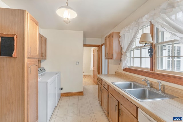 129 W Park Dr, Charlottesville, VA 22901 - kitchen featuring washing machine and dryer, light floors, light countertops, and a sink