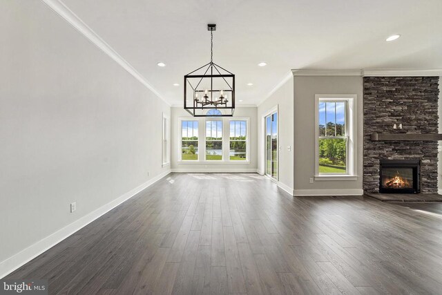 9435 Signature Way, Fredericksburg, VA 22407 - unfurnished living room featuring a chandelier, plenty of natural light, crown molding, baseboards, and recessed lighting
