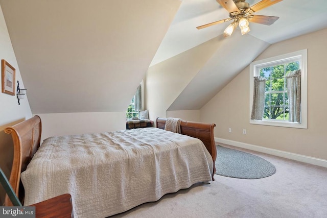  - bedroom featuring carpet, vaulted ceiling, and a ceiling fan