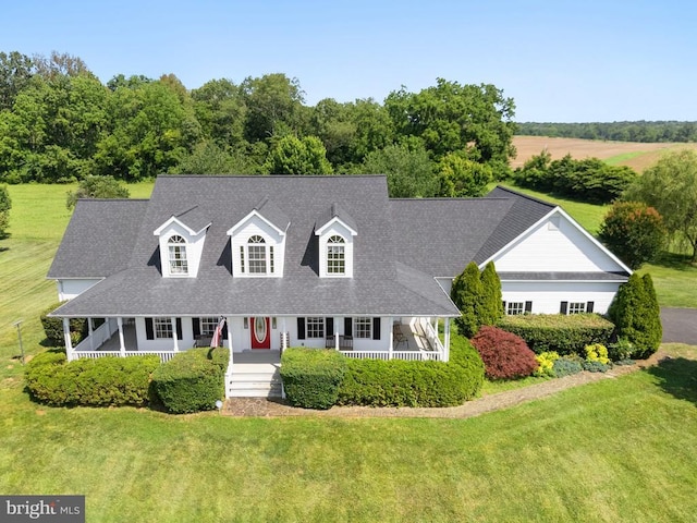  - new england style home with covered porch, a front lawn, and a shingled roof