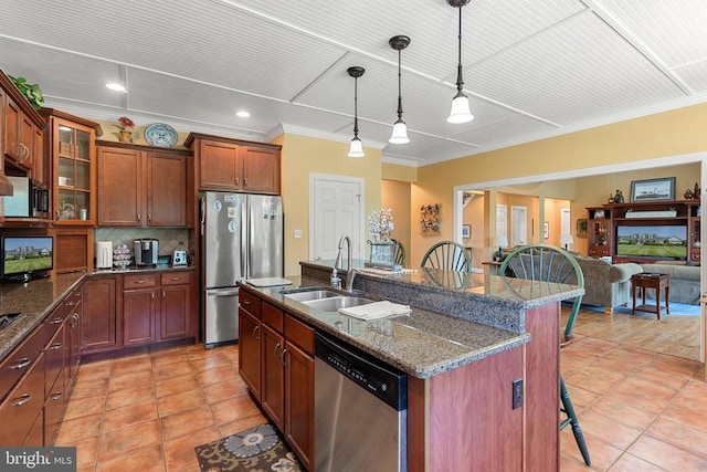  - kitchen featuring stainless steel appliances, a breakfast bar area, ornamental molding, tasteful backsplash, and glass insert cabinets