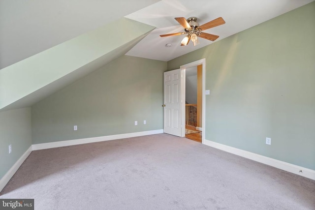 - additional living space featuring carpet flooring, ceiling fan, and vaulted ceiling