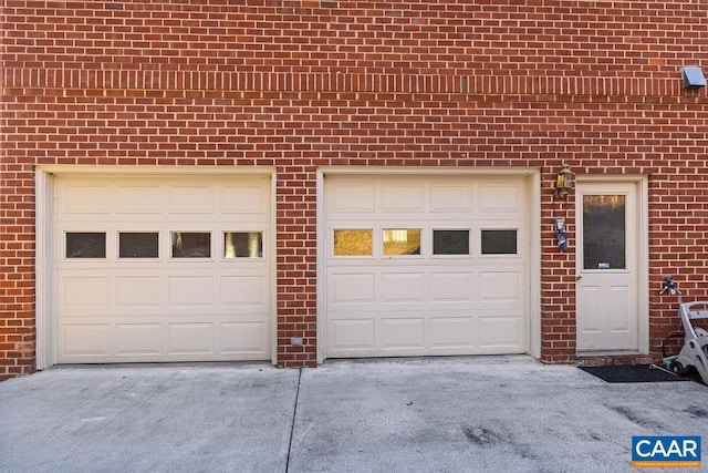 garage with concrete driveway