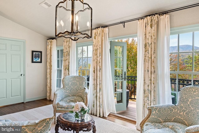 1126 F T Valley Rd, Sperryville, VA 22740 - living area featuring a chandelier, plenty of natural light, wood finished floors, lofted ceiling, and baseboards