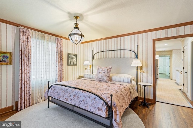 1126 F T Valley Rd, Sperryville, VA 22740 - bedroom featuring wallpapered walls, wood finished floors, crown molding, and baseboards