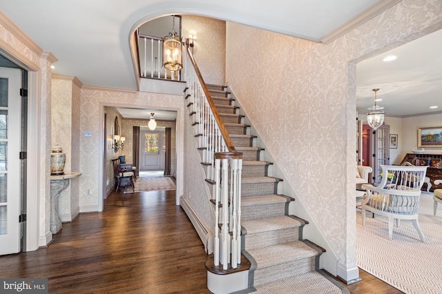 1126 F T Valley Rd, Sperryville, VA 22740 - entrance foyer with wallpapered walls, ornamental molding, a chandelier, a baseboard radiator, and wood finished floors