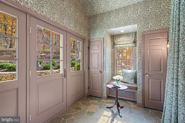 1126 F T Valley Rd, Sperryville, VA 22740 - doorway with wallpapered walls and light stone finish flooring