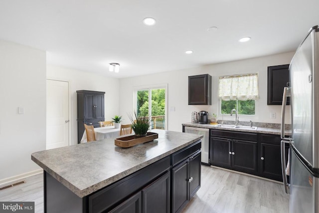 5014 Godwins Landing Dr, Remington, VA 22734 - kitchen with stainless steel refrigerator, dishwashing machine, light wood-type flooring, a center island, and recessed lighting