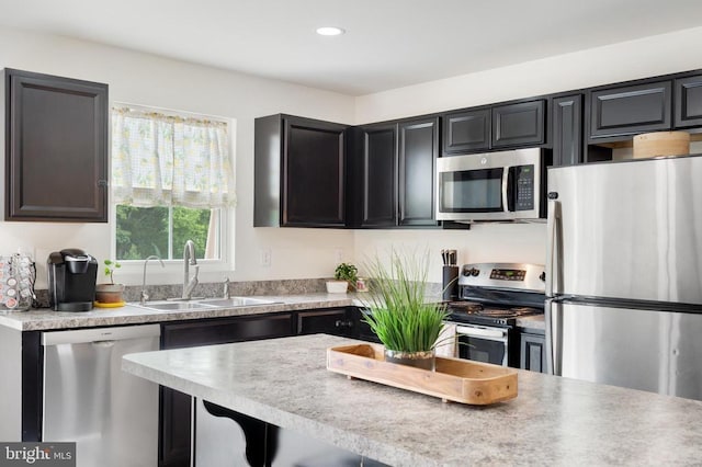 5014 Godwins Landing Dr, Remington, VA 22734 - kitchen featuring appliances with stainless steel finishes, recessed lighting, light countertops, and dark cabinetry