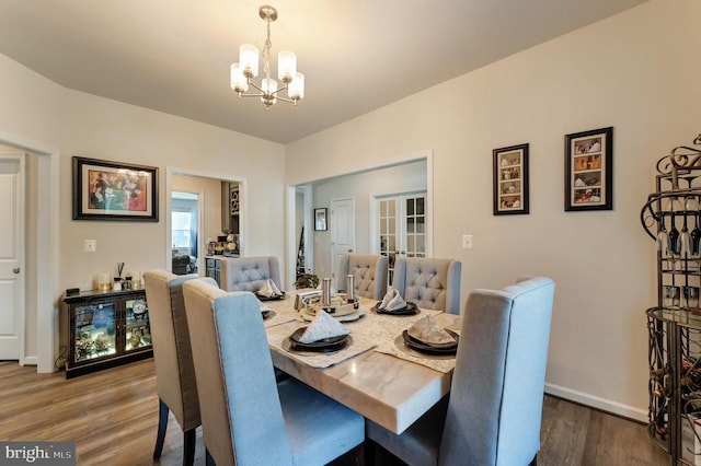 11726 Robin Woods Cir, Spotsylvania, VA 22551 - dining space featuring a chandelier, french doors, wood finished floors, and baseboards