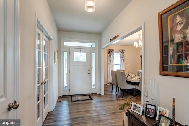 11726 Robin Woods Cir, Spotsylvania, VA 22551 - foyer entrance with wood finished floors, a chandelier, and baseboards