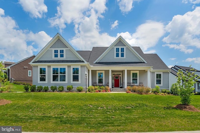 11726 Robin Woods Cir, Spotsylvania, VA 22551 - view of front facade with a porch, a front lawn, a standing seam roof, and board and batten siding