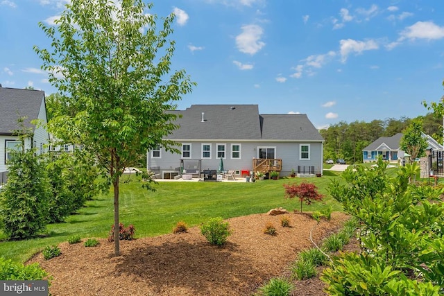 11726 Robin Woods Cir, Spotsylvania, VA 22551 - rear view of house featuring a patio, a yard, and a wooden deck