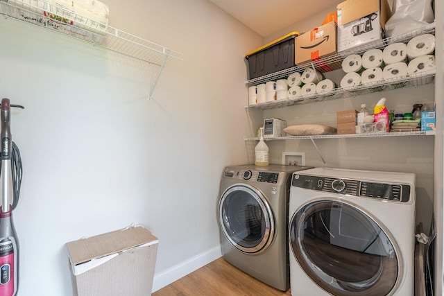 10 Samuel Bears Rd, Weyers Cave, VA 24486 - laundry room with washer and clothes dryer, light wood-style floors, and baseboards