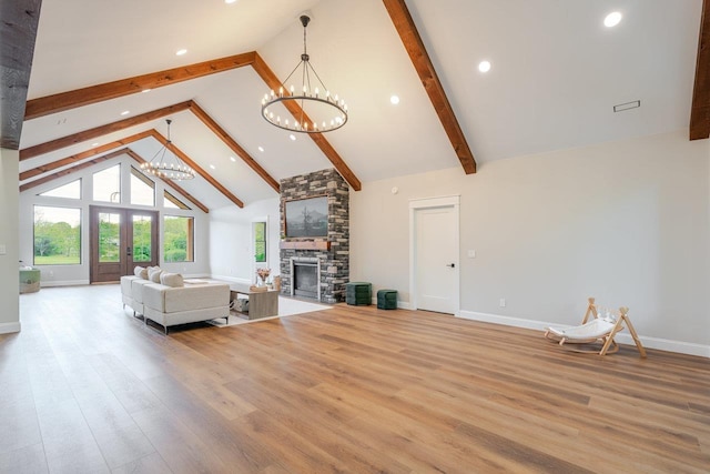 10 Samuel Bears Rd, Weyers Cave, VA 24486 - living room featuring a chandelier, beam ceiling, a fireplace, wood finished floors, and high vaulted ceiling