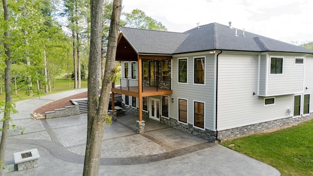 10 Samuel Bears Rd, Weyers Cave, VA 24486 - rear view of property featuring a patio area, roof with shingles, and a balcony