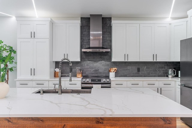 10 Samuel Bears Rd, Weyers Cave, VA 24486 - kitchen featuring wall chimney range hood, appliances with stainless steel finishes, a sink, decorative backsplash, and white cabinets