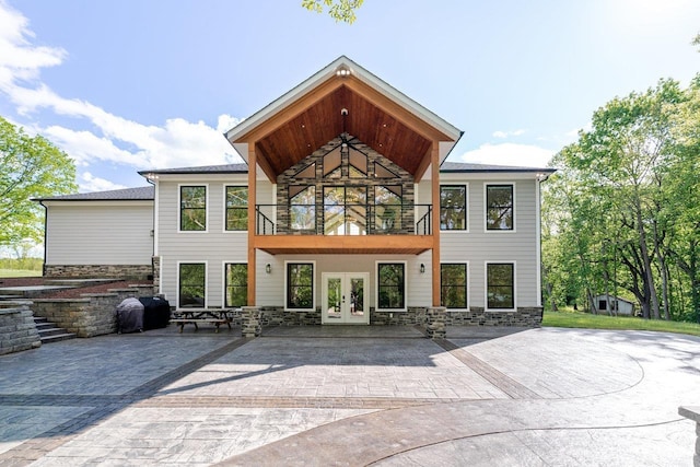 10 Samuel Bears Rd, Weyers Cave, VA 24486 - back of house with french doors, a balcony, stone siding, and a patio area