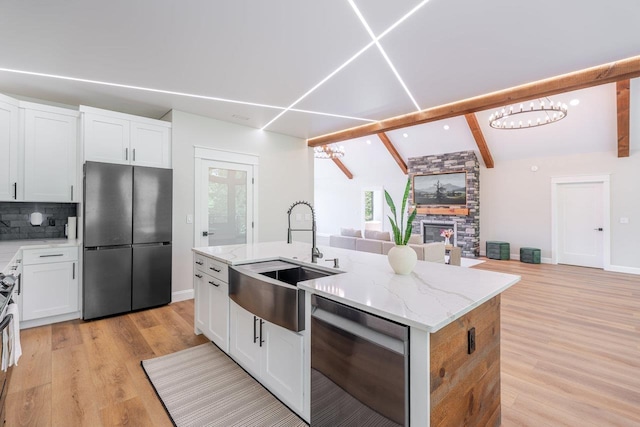 10 Samuel Bears Rd, Weyers Cave, VA 24486 - kitchen featuring stainless steel appliances, a sink, open floor plan, an island with sink, and healthy amount of natural light