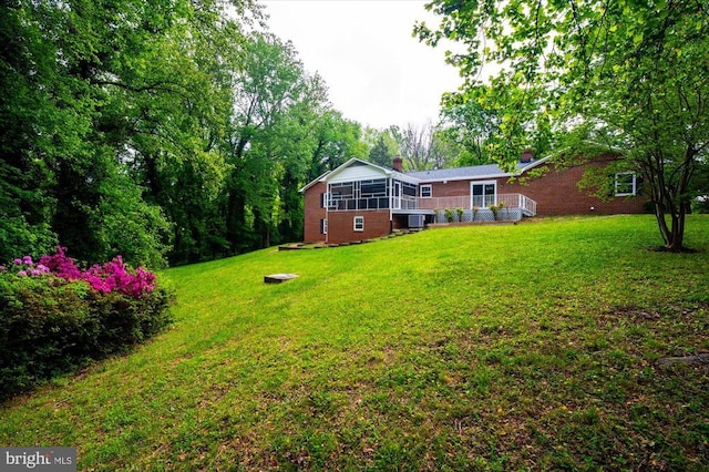 view of yard with a sunroom
