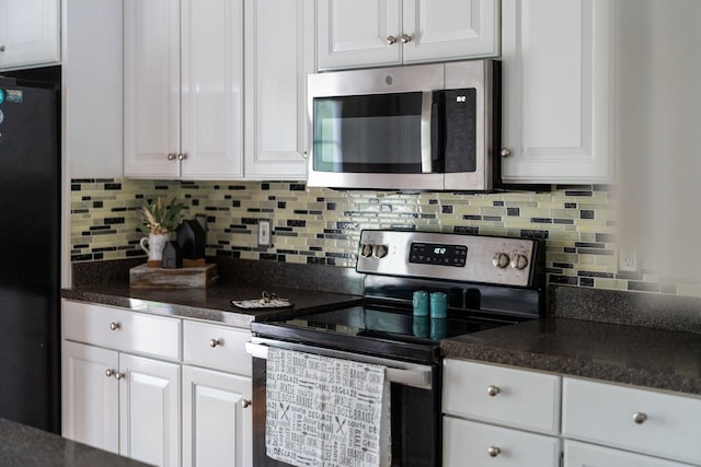 47 Villa View Dr, Staunton, VA 24401 - kitchen featuring appliances with stainless steel finishes, dark countertops, white cabinets, and backsplash