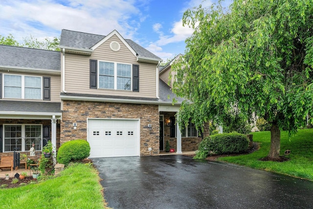 47 Villa View Dr, Staunton, VA 24401 - view of front of home featuring driveway, an attached garage, roof with shingles, and stone siding