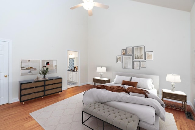 47 Villa View Dr, Staunton, VA 24401 - bedroom featuring a high ceiling, wood finished floors, baseboards, ensuite bathroom, and a ceiling fan