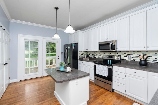 47 Villa View Dr, Staunton, VA 24401 - kitchen featuring stainless steel appliances, dark countertops, backsplash, crown molding, and white cabinets