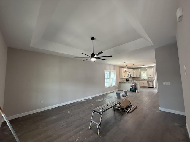 1522 2nd St, Waynesboro, VA 22980 - living room with a raised ceiling, dark wood-style flooring, ceiling fan, and a chandelier